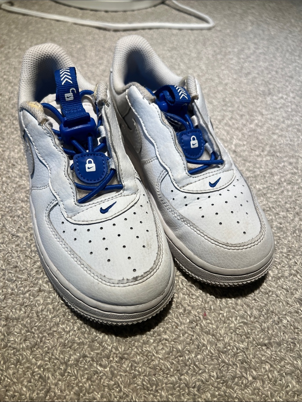 Nike Kids White Sneakers with Royal Blue Accents